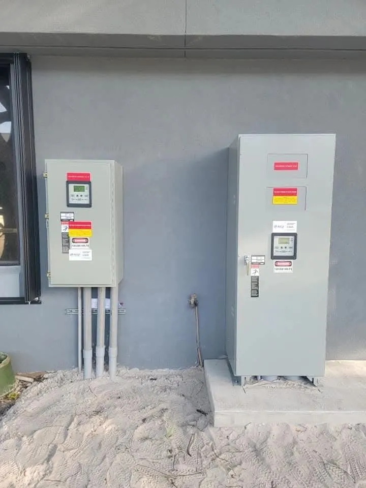 Automatic transfer switches installed on a building wall