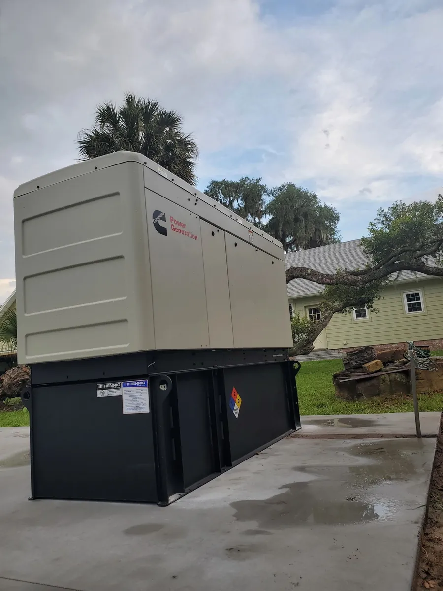 Cummins standby generator installed on a concrete pad